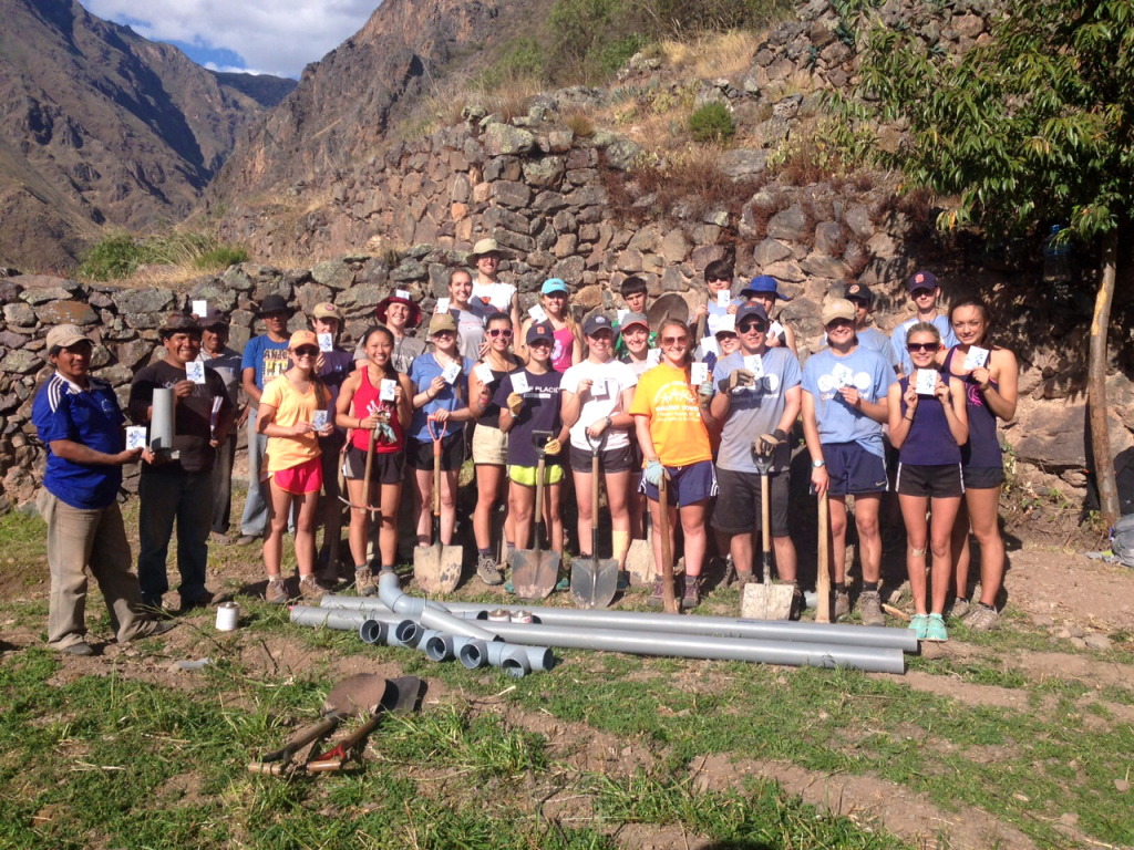 Students from Fairport, NY with our foremen in Ollantaytambo holding the seeds after we finished our service project. 